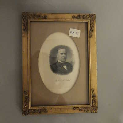 Engraving of President McKinley in gold frame with oval mat