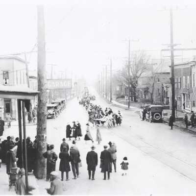People watching a parade in New Berlin, Ohio in the early 1900's.