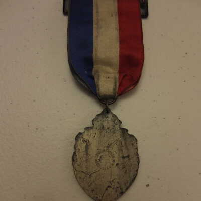 S. of U. V., 61st Encampment badge, 1927.
