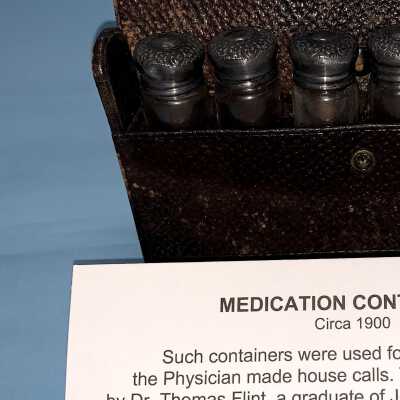 MED KIT, LEATHER, EMPTY BOTTLES WITH FANCY CAPS