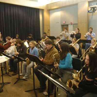 Matthew Buchman, associate professor of music and director of jazz studies at the University of Wisconsin-Stevens Point, conducts jazz students in the rehearsal.
