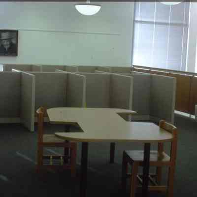 1/14/03, Emmons office products. Workers setting up computer cubicles in C.M. White library