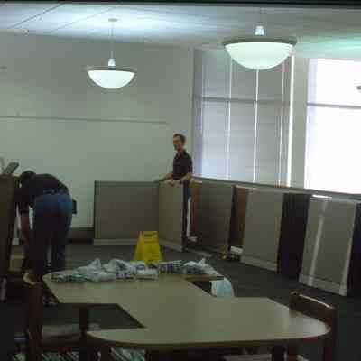 1/14/03, Emmons office products workers setting up computer cubicles in C.M. White library