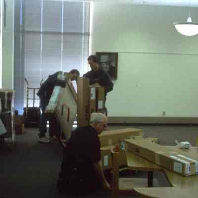 1/14/03, Emmons office products workers setting up computer cubicles in C.M. White library