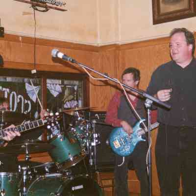 Scott Street Pub, Wausau. L-R, Michael Boyle (guitar), Brad Love (drums), Ken Stevenson (bass), Otis McLennon (harmonica, vocals)