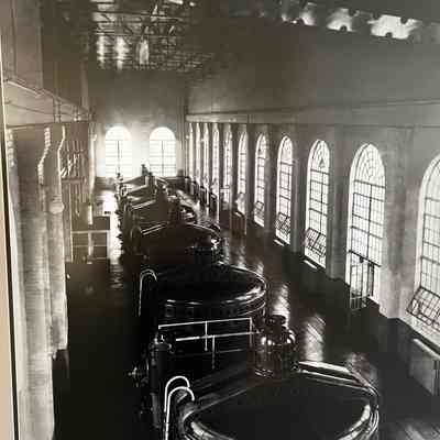Unknown date, showing the inside of the dam powerhouse. 6 vertical generating units are shown.