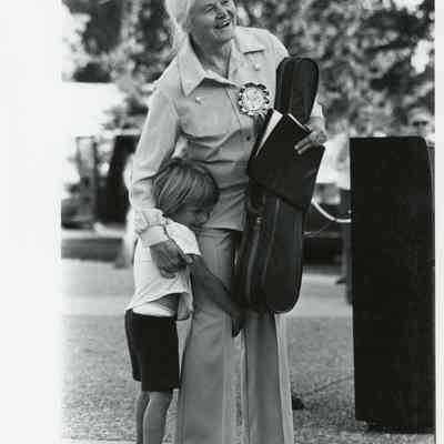 Margery Aber hugs a student at the American Suzuki Institute