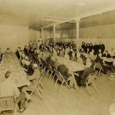 Men Sitting for Meal at Tables