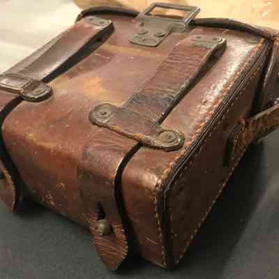 2016.11.54c (binoculars case, side): Copyright: The Salvation Army Central Territory Historical Museum; Origsize: 6" x 6.125" x ?; Origformat: Artifact