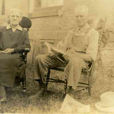 Minnie "Ma" and Elmer Burdick Seated Outside in Chairs