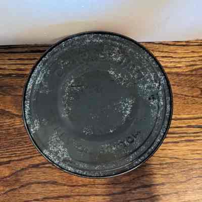 Top of the can featuring an embossing of the words "Drip Grind" and "Key on Bottom. Number 125 stamped near the center.