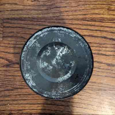 Bottom of the can where the key would have been.