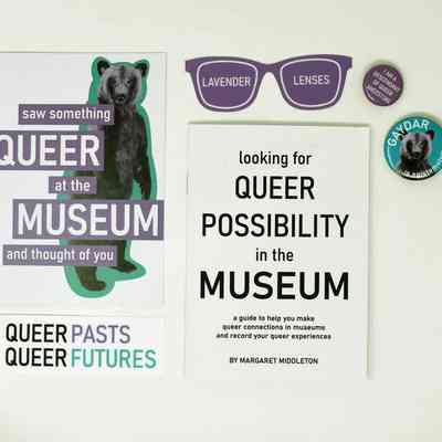 Postcard (with the image of a bear), stickers and a booklet.