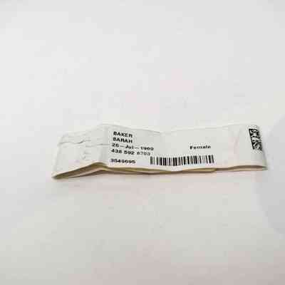 A white hospital bracelet in the name of Sarah Baker.