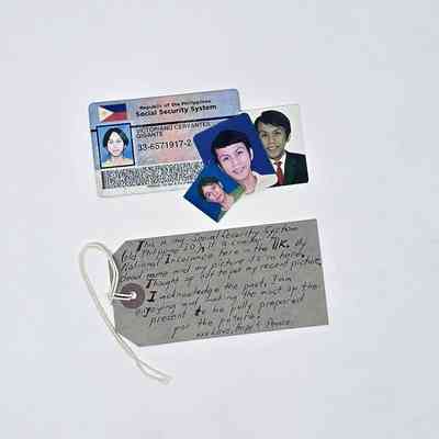 Card has three small photographs glued to it, signs of wear, photos look old.