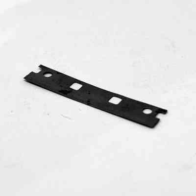 A dark grey safety razor blade