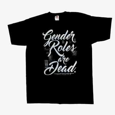 A black short sleeved t-shirt with the slogan "Gender roles are dead" printed in white cursive font. The label of the t-shirt is visible, showing the brand name "Fruit of the Loom" and size M