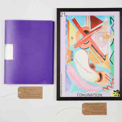 The image shows a vibrant abstract painting labeled "Coronation" beside a purple book.