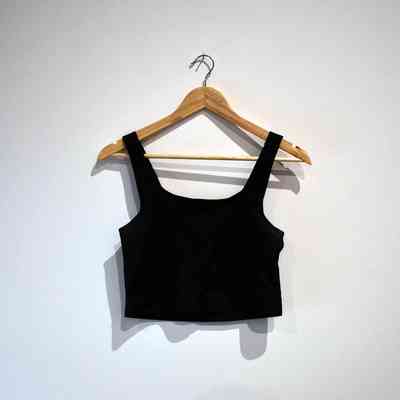 A black binder on a wooden hanger.