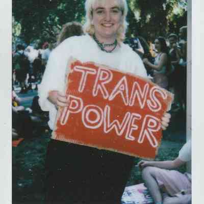 A person at London Trans Pride 2022 holds a sign reading "Trans Power".