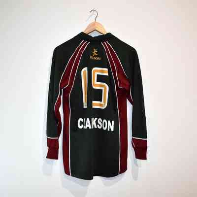 A football long sleeved t-shirt which has the no.15 on it.