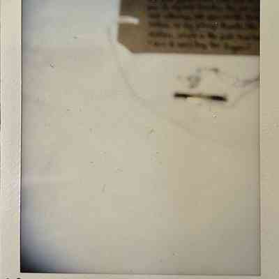 A blurry photograph of a necklace.