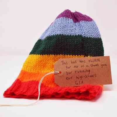 A knitted rainbow hat.