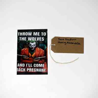 A photograph which has a person it and the words"Throw Me To The Wolves And I'll Come Back Pregnant" and a label sit against a white background.