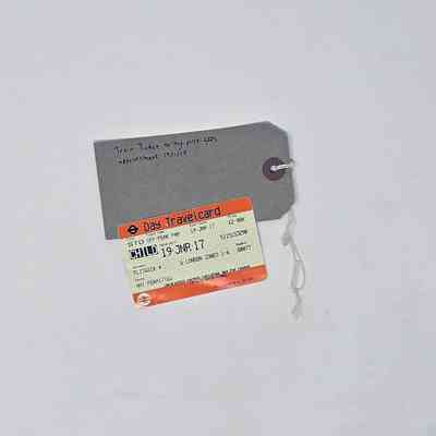Train ticket Day Travelcard for Flitwick to London; reasonable condition, few wrinkles, slight chip/blemish near the letter "T" in Travelcard. Crease at bottom.