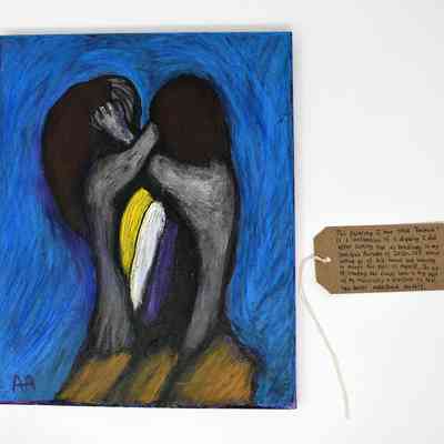 The painting shows two abstract figures embracing against a vibrant blue background with written notes attached.