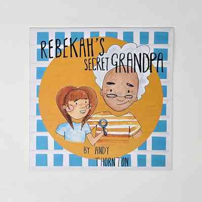 Photograph of the book 'Rebekah's Secret Grandpa' by Andy Thornton which shows an illustration of a young person with long brown hair and an older person with grey hair and glasses. The younger person is holding a magnifying glass.