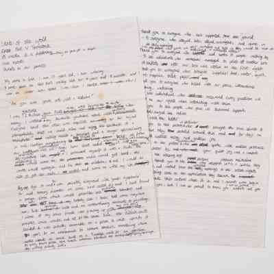 Two lined sheets of A4 paper with the handwritten text of a speech written in black pen.
