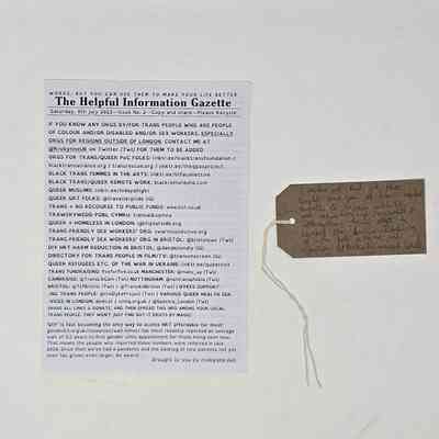 A leaflet and tag discussing trans support organisations.