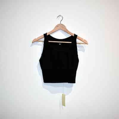 A black full-length binder is laid flat on a hanger.