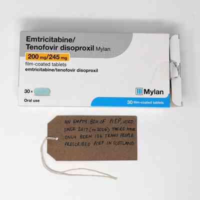 An empty box of PrEP (Emtricitabine/ Tenofovir disoproxil). With a brown handwritten luggage tag.