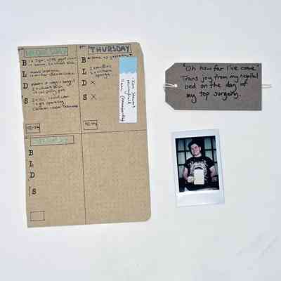 A brown dotted paper page from a journal on the day the donor had top surgery. With a polaroid of the donor and a brown handwritten luggage tag.