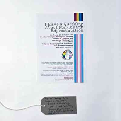 A Flyer advertising an event entitled "I have a Que(e)ry about Non-Binary Representation". With a brown, handwritten luggage tag.