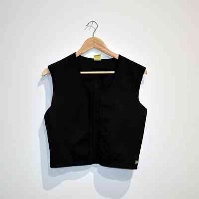 Black half-length binder with hooks in the front. A small white tag is visible on the back of the neck.