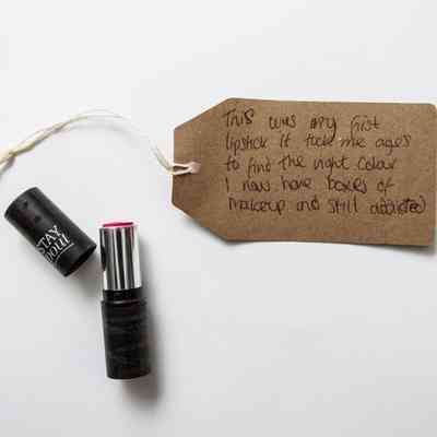 Black lipstick tube reading "Stay Pout"