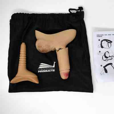 A Peecock Stand to Pee packer with insert. The packer has been broken. With a black satin bag and instruction leaflet.