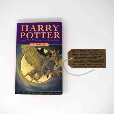 The image shows a copy of "Harry Potter and the Prisoner of Azkaban" with a handwritten tag beside.