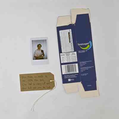 Testogel Box (from Dunmore pharmacy), a Polaroid and a brown luggage tag