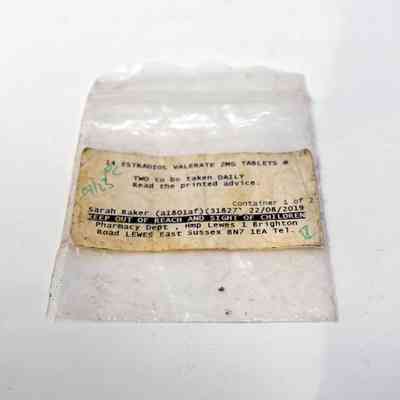 A small, zip-loc baggie with a prescription label for 14 Estradiol Valerate 2mg tablets, prescribed to Sarah Baker.
