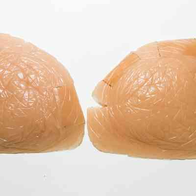 Pair of prosthetic silicone breasts.