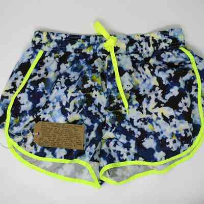These are colorful gym shorts with neon yellow trim, accompanied by a handwritten note attached.