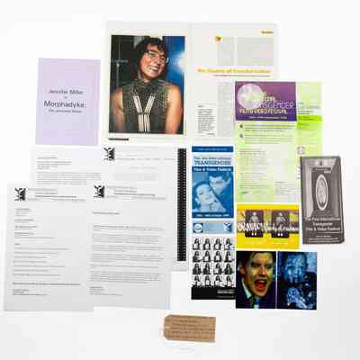 Various letters, photos, flyers and articles regarding the Transgender Film and Video Festivals of 1997, 1998 and 1999. With a brown, handwritten luggage tag.
