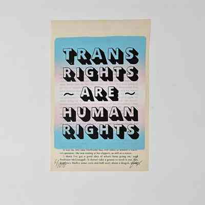 Single page of a Harry Potter book with block text stamped over the top. This text is a blue to pink gradient and reads "TRANS RIGHTS ~ARE~ HUMAN RIGHTS"