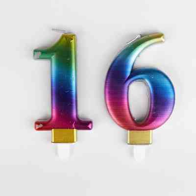 Two candles, one '1' and one '6' to spell '16'. The candles are rainbow coloured.
