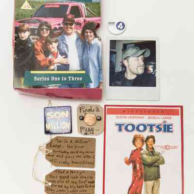 The image includes a DVD cover, a badge, a photo, movie artwork, and labeled personal items.