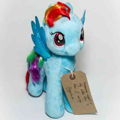 Light blue soft toy horse/pony, specifically the character "Rainbow Dash" from My Little Pony. The toy is clean and the hair/mane is straight and appears well kept.